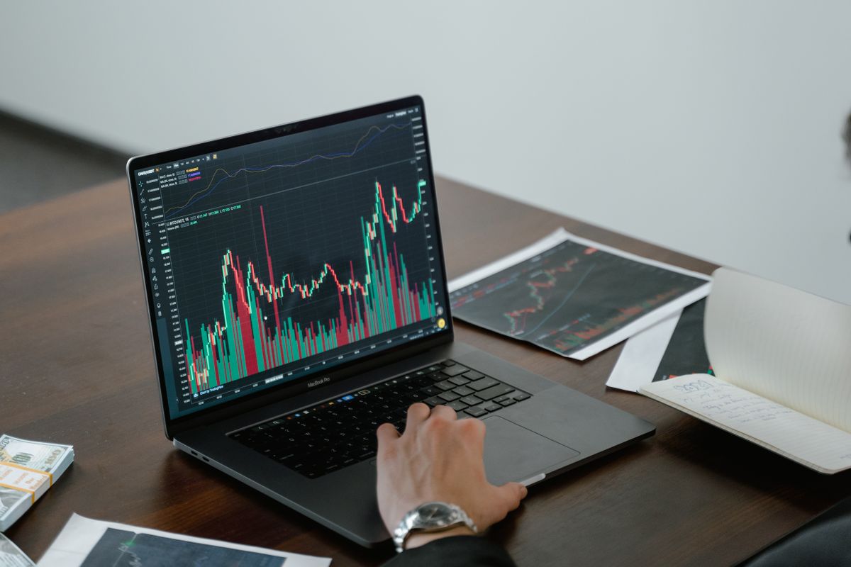 Market charts shown on a laptop screen