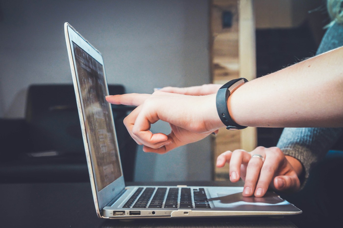 Professional reviewing information on a laptop